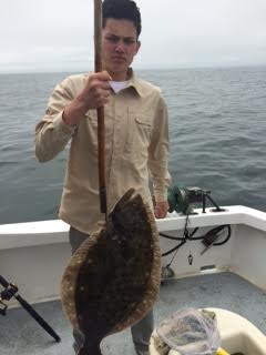 Despite feeling a little woozy Pierce had a great time landing this 25lb Halibut!!