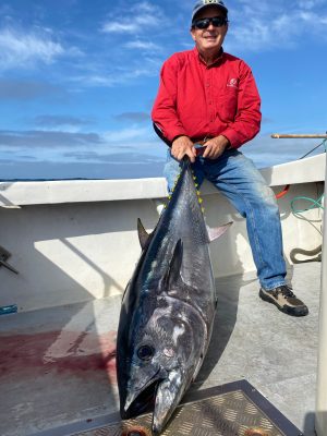a person holding a fish