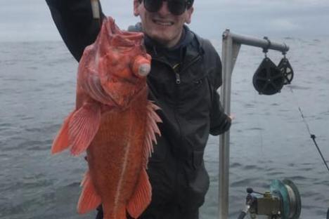 young boy with rockfish