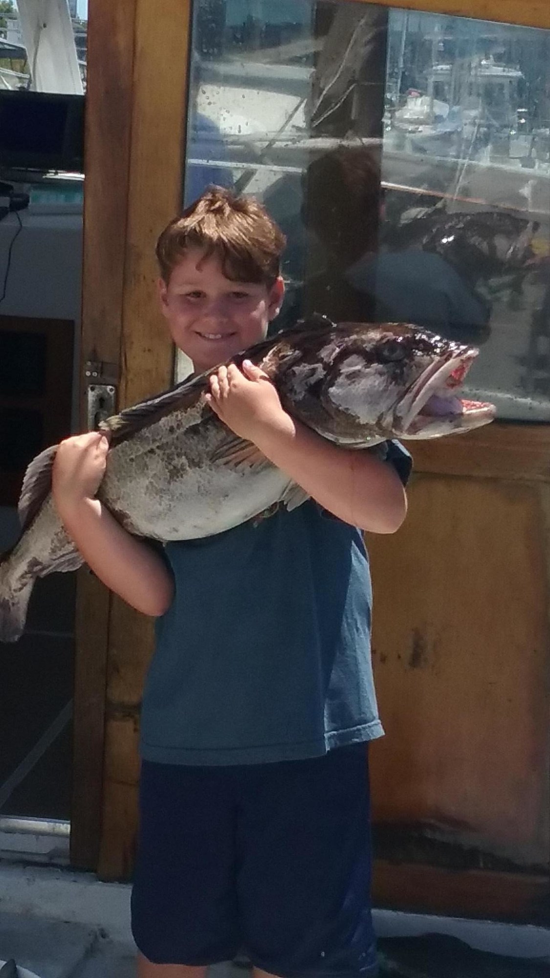 Shane's son, Jesse holding fish