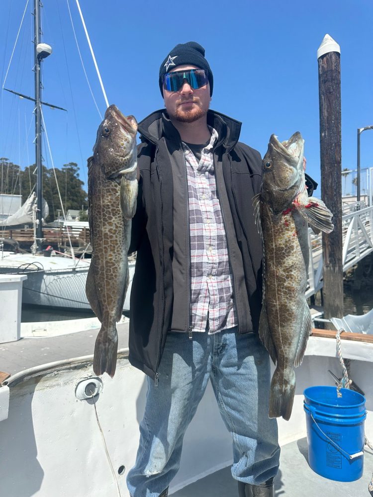 a man holding a fish